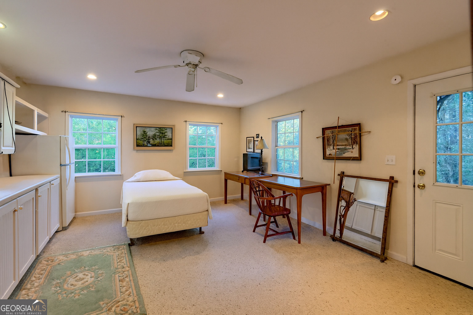 11 Copperhead Lane Clayton, GA 30525 - Photo 13 of 25 a spacious bedroom with a bed a table and a large window