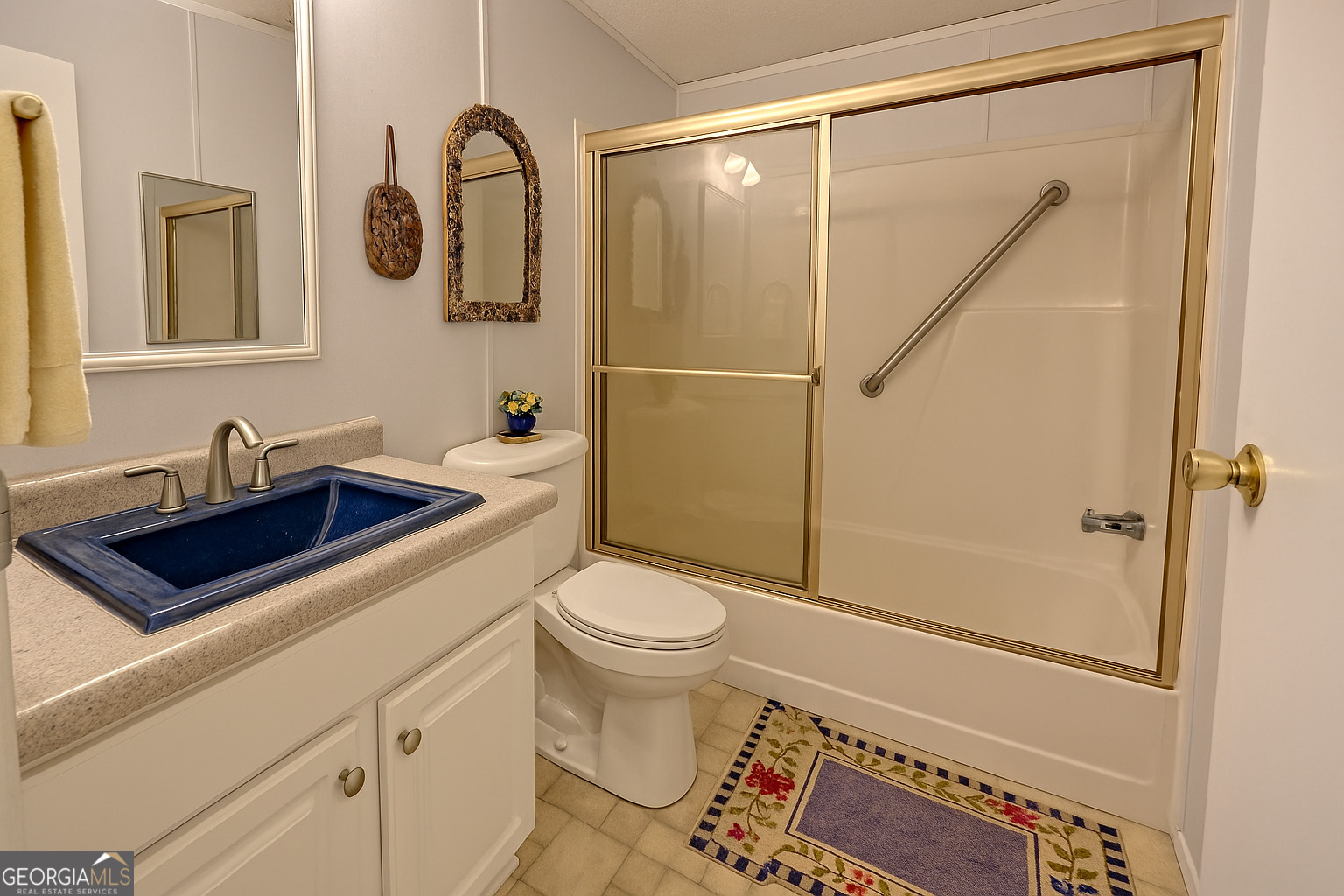 11 Copperhead Lane Clayton, GA 30525 - Photo 14 of 25 a bathroom with a sink a toilet and shower