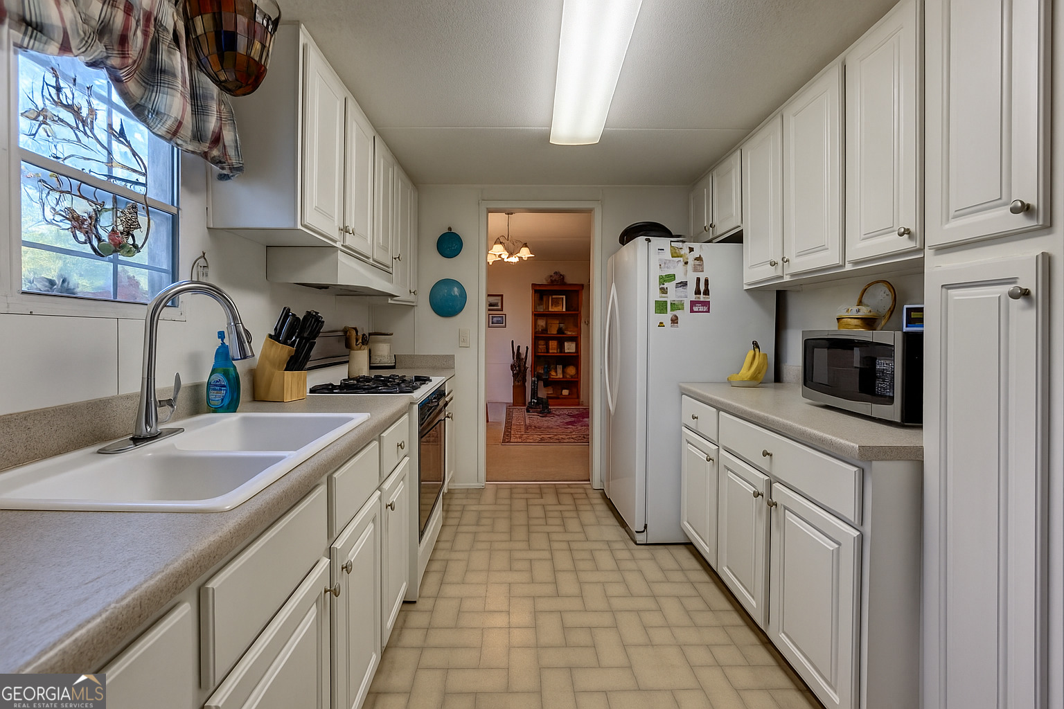 11 Copperhead Lane Clayton, GA 30525 - Photo 4 of 25 a kitchen with stainless steel appliances granite countertop a sink and dishwasher refrigerator stove