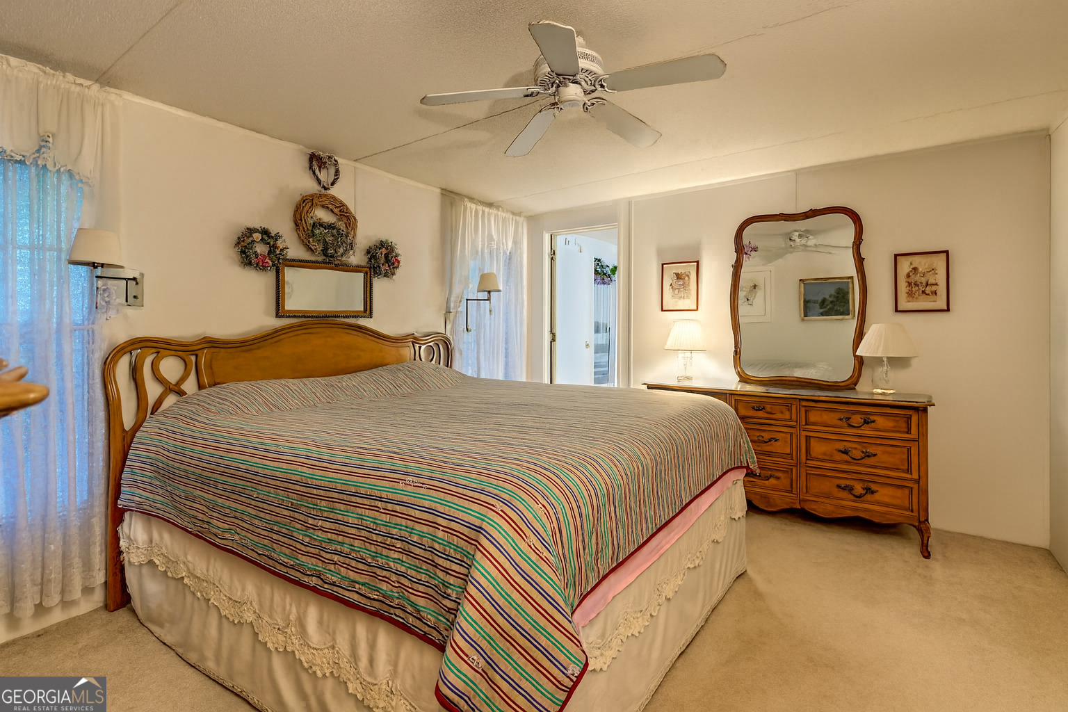 11 Copperhead Lane Clayton, GA 30525 - Photo 8 of 25 a bedroom with a bed and a chandelier