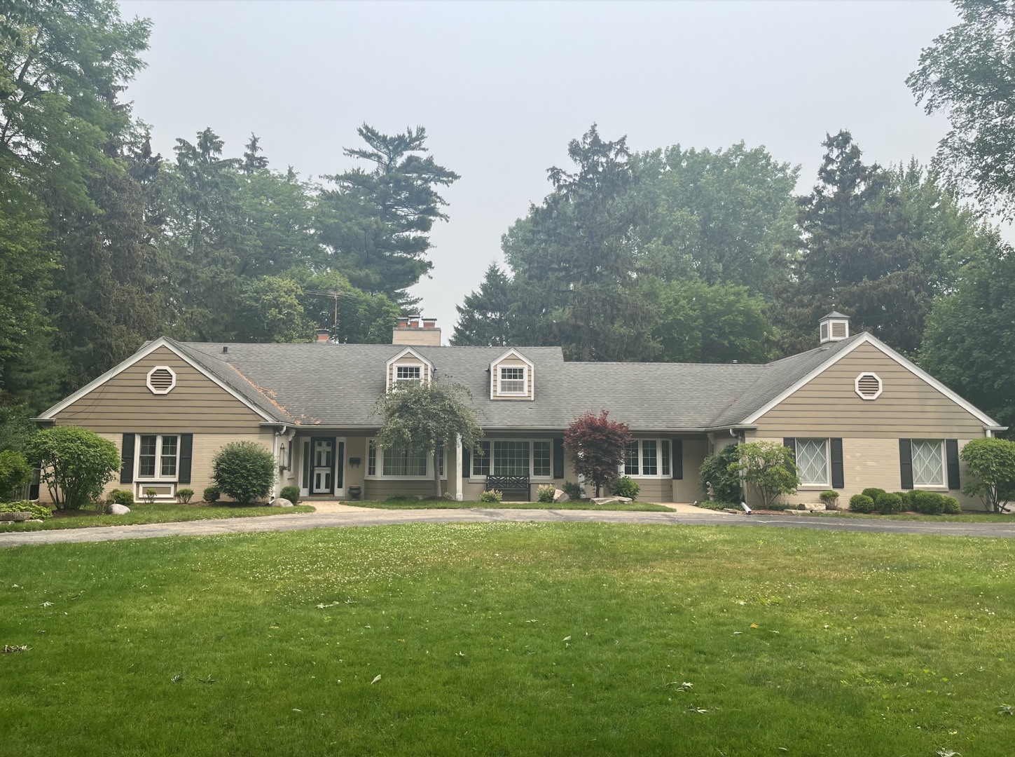 177 Woodley Road Winnetka, IL 60093 - Photo 1 of 1 a front view of a residential houses with yard and green space