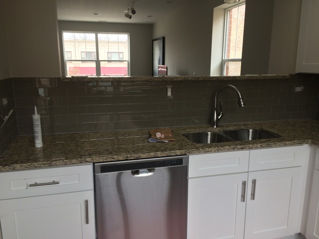 2314 East 71st Street, Unit B Chicago, IL 60649 - Photo 7 of 19 a bathroom with a sink and a mirror
