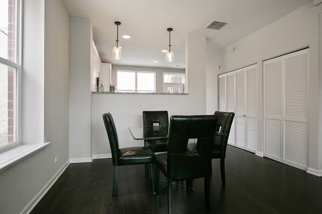 2314 East 71st Street, Unit B Chicago, IL 60649 - Photo 8 of 19 a view of a dining room with furniture and a window