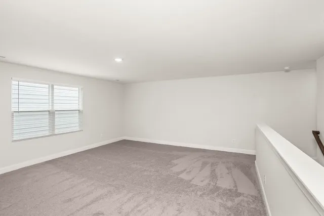 an empty room with a empty space and window