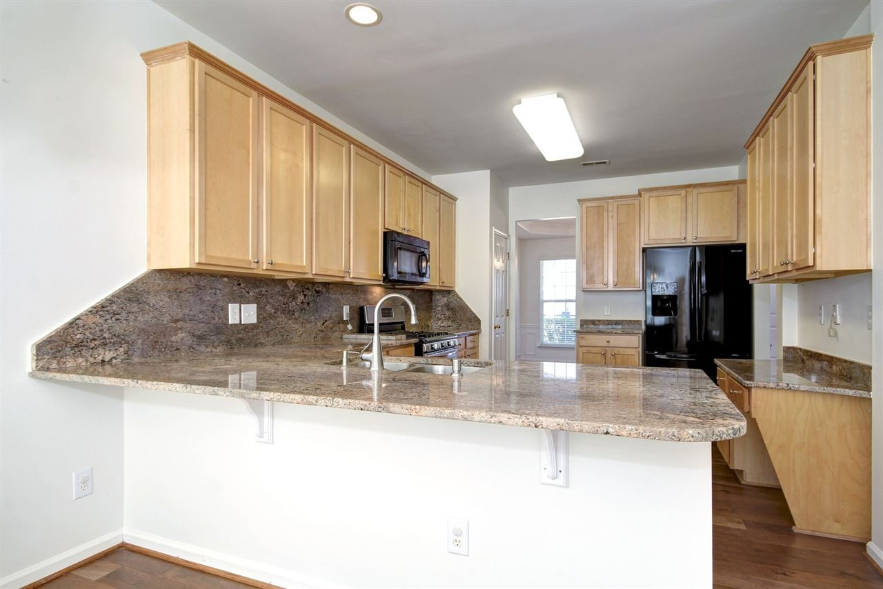 7444 Lagrange Drive Raleigh, NC 27613 - Photo 9 of 30 Oversize breakfast bar for seating with a breakfast room as well! Invite all of your friends and family to enjoy a nice meal together. Kitchen