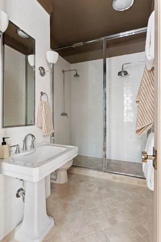 a bathroom with a sink and mirror