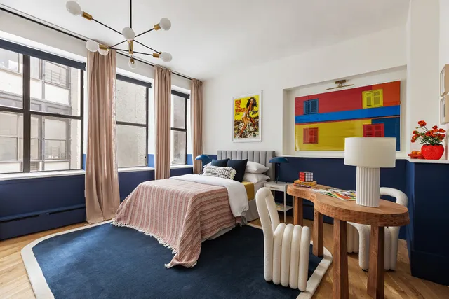 a bed room with a bed and a window