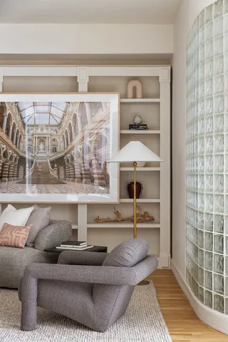 a living room with furniture and a rug