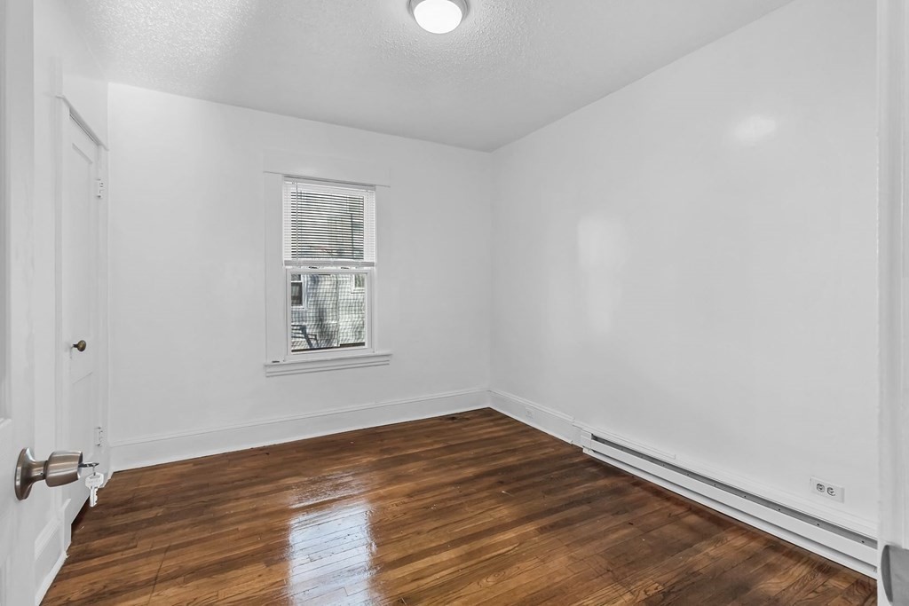 55 Redlands Street Springfield, MA 01104 - Photo 12 of 42 wooden floor in an empty room