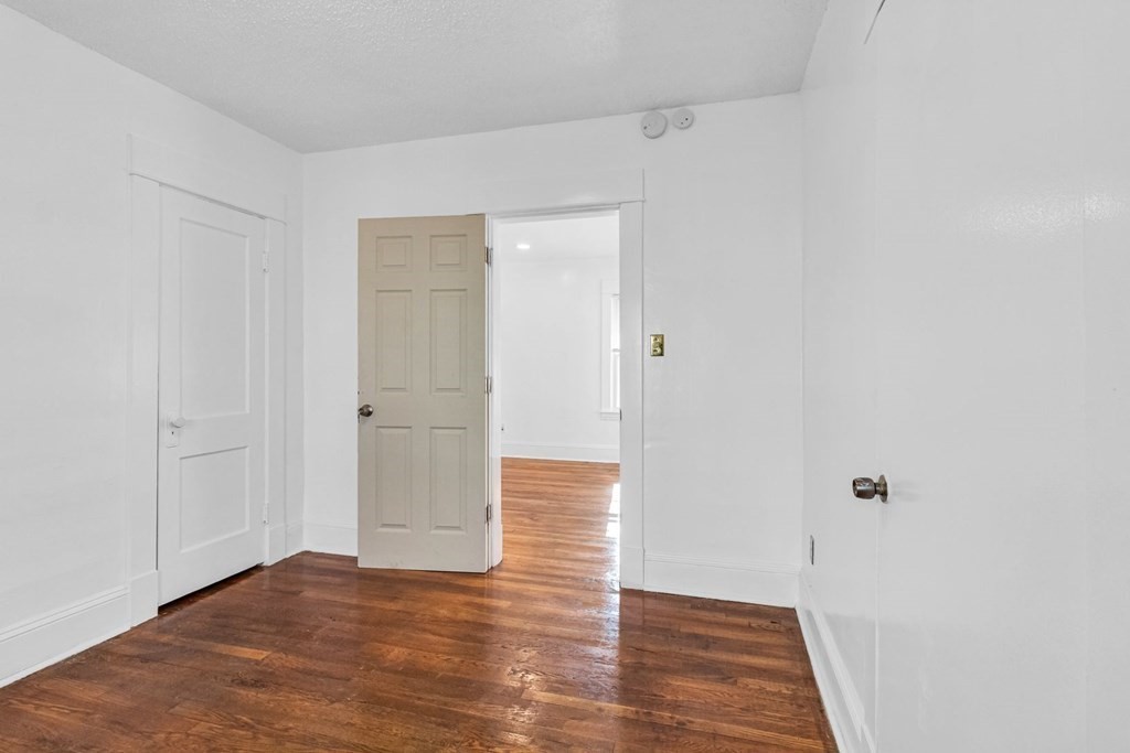 55 Redlands Street Springfield, MA 01104 - Photo 19 of 42 a view of an empty room with wooden floor