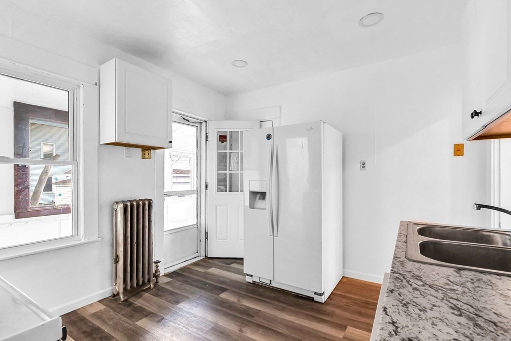 55 Redlands Street Springfield, MA 01104 - Photo 2 of 42 a bedroom with a bed and a window