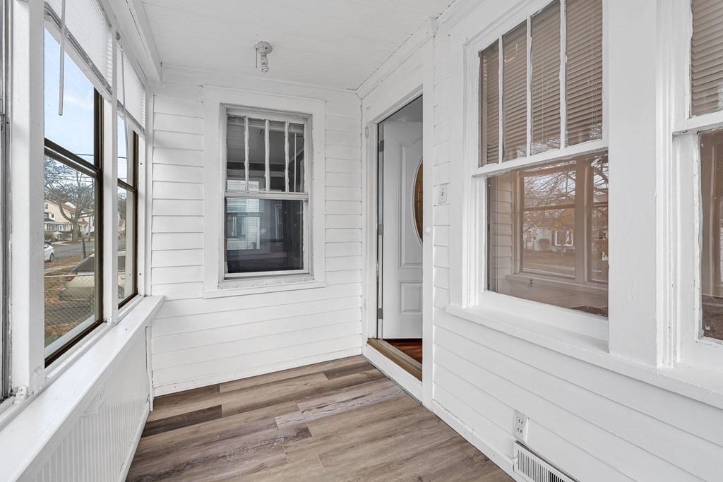 55 Redlands Street Springfield, MA 01104 - Photo 23 of 42 a view of an entryway with wooden floor and door