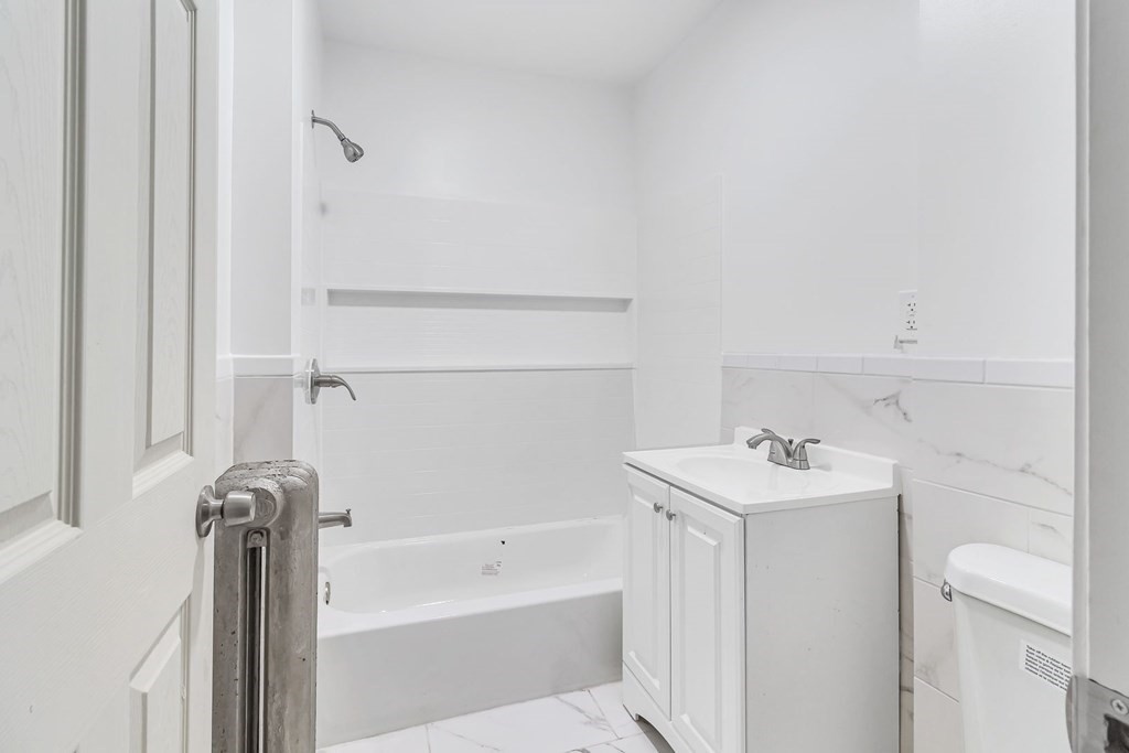 55 Redlands Street Springfield, MA 01104 - Photo 24 of 42 a bathroom with a sink a toilet and shower