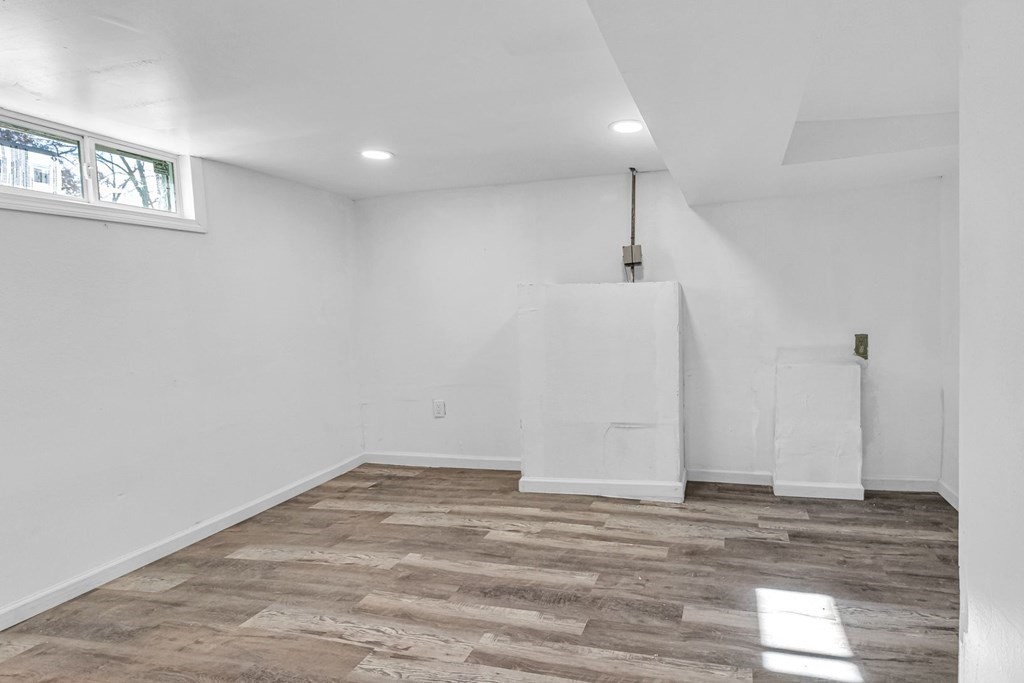 55 Redlands Street Springfield, MA 01104 - Photo 32 of 42 a view of a room with wooden floor and window