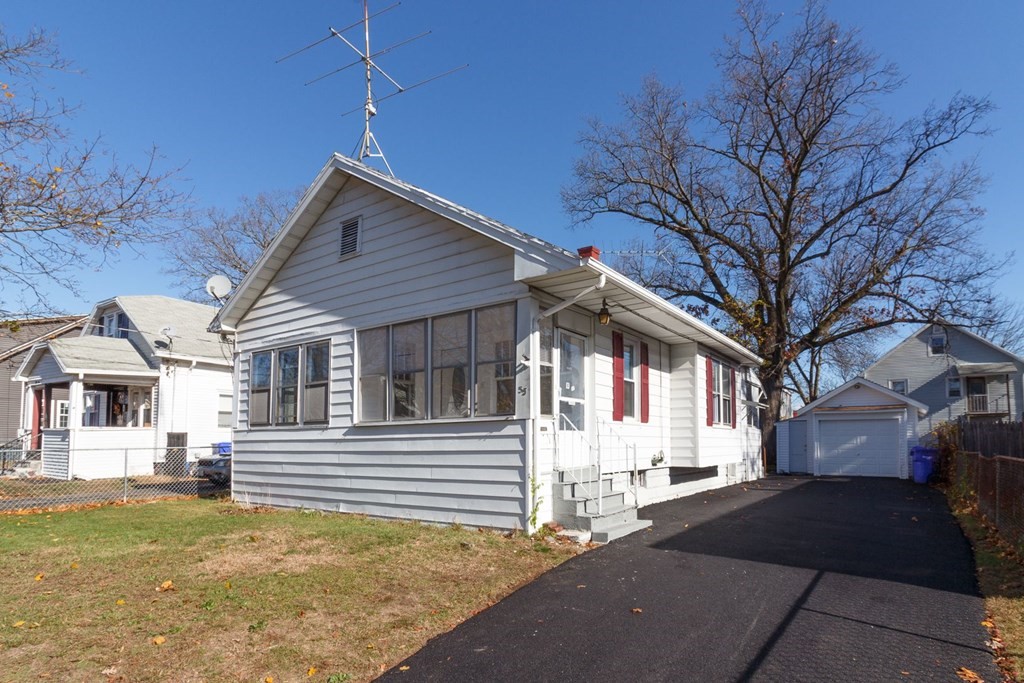 55 Redlands Street Springfield, MA 01104 - Photo 41 of 42 a front view of a house with a yard
