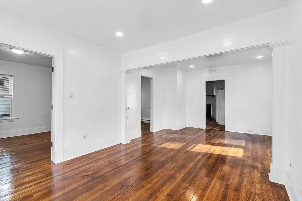 55 Redlands Street Springfield, MA 01104 - Photo 9 of 42 a view of an empty room and wooden floor