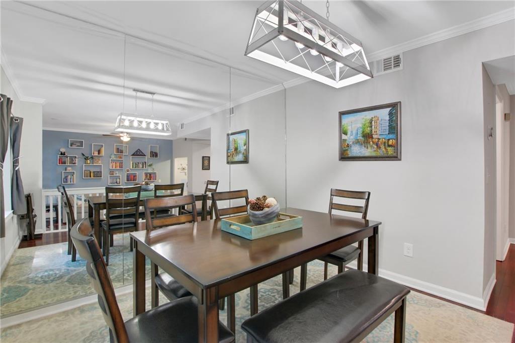 1929 Variations Drive Northeast Atlanta, GA 30329 - Photo 12 of 33 a view of a dining room with furniture and chandelier