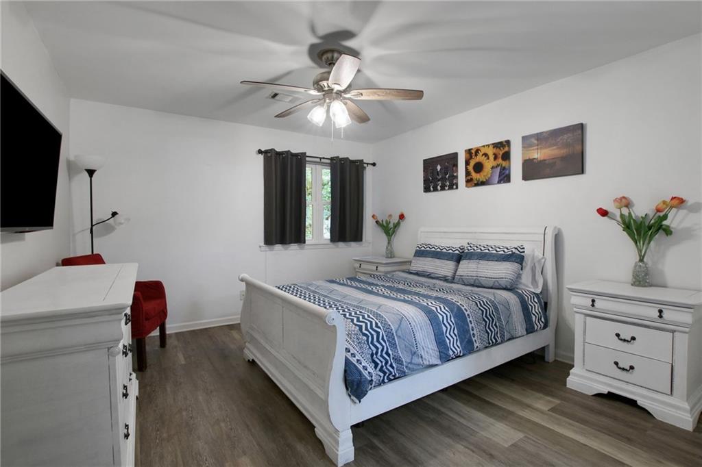 1929 Variations Drive Northeast Atlanta, GA 30329 - Photo 20 of 33 a bedroom with a bed and a flat screen tv