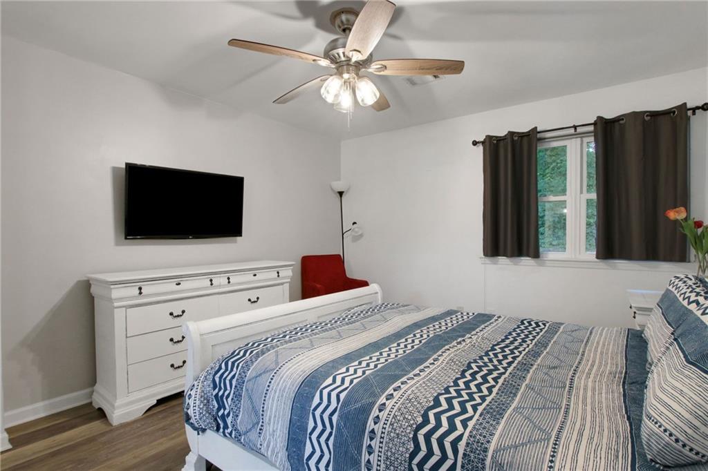 1929 Variations Drive Northeast Atlanta, GA 30329 - Photo 21 of 33 a bedroom with a bed tv and a window