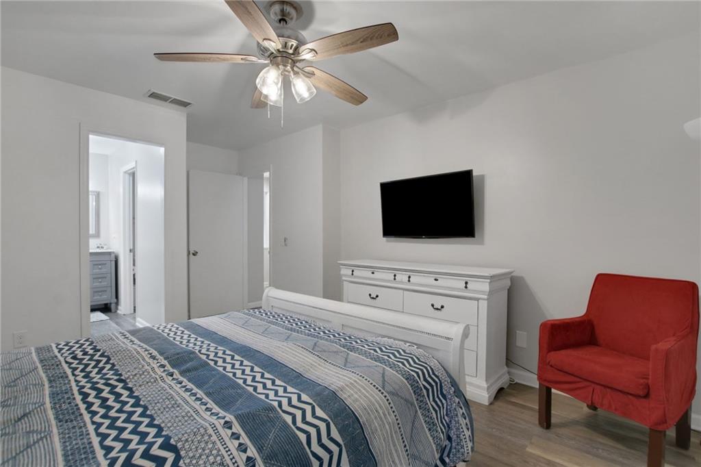 1929 Variations Drive Northeast Atlanta, GA 30329 - Photo 23 of 33 a bedroom with a bed and a flat screen tv