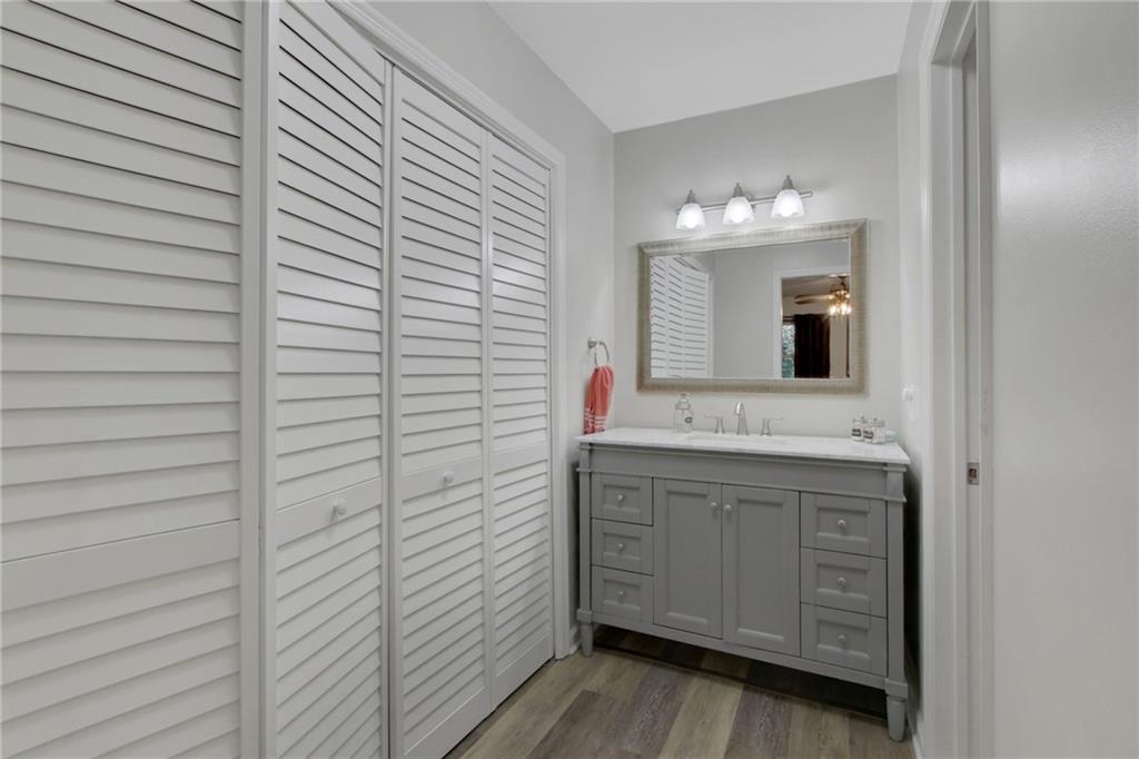1929 Variations Drive Northeast Atlanta, GA 30329 - Photo 25 of 33 a bathroom with a sink and a mirror