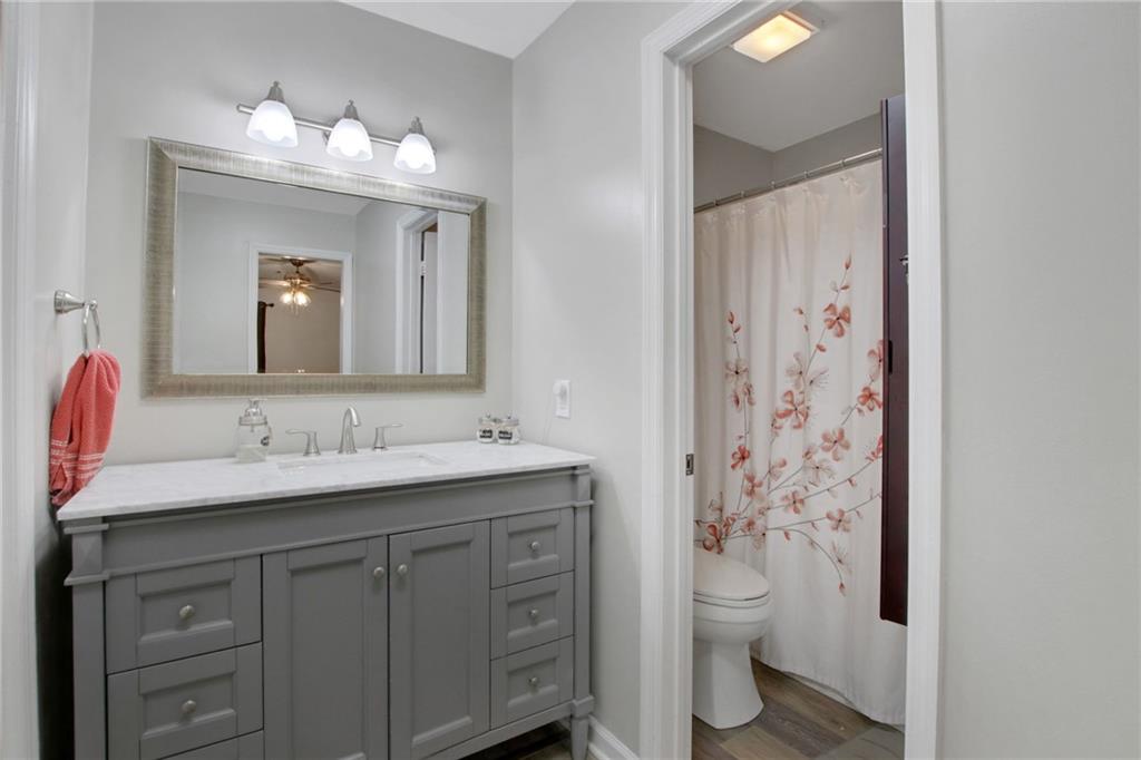 1929 Variations Drive Northeast Atlanta, GA 30329 - Photo 26 of 33 a bathroom with a toilet sink and mirror