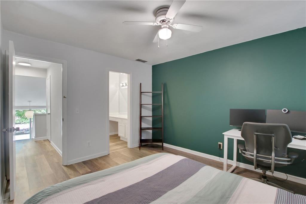 1929 Variations Drive Northeast Atlanta, GA 30329 - Photo 28 of 33 a bedroom with a bed and a chair