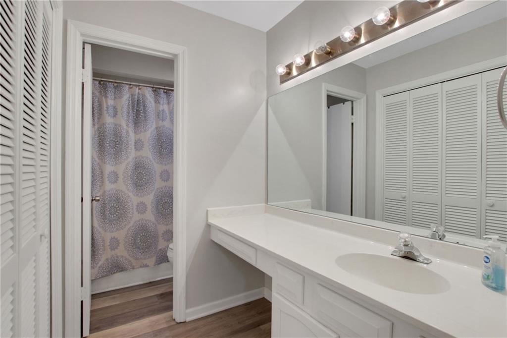 1929 Variations Drive Northeast Atlanta, GA 30329 - Photo 29 of 33 a bathroom with a sink and a mirror