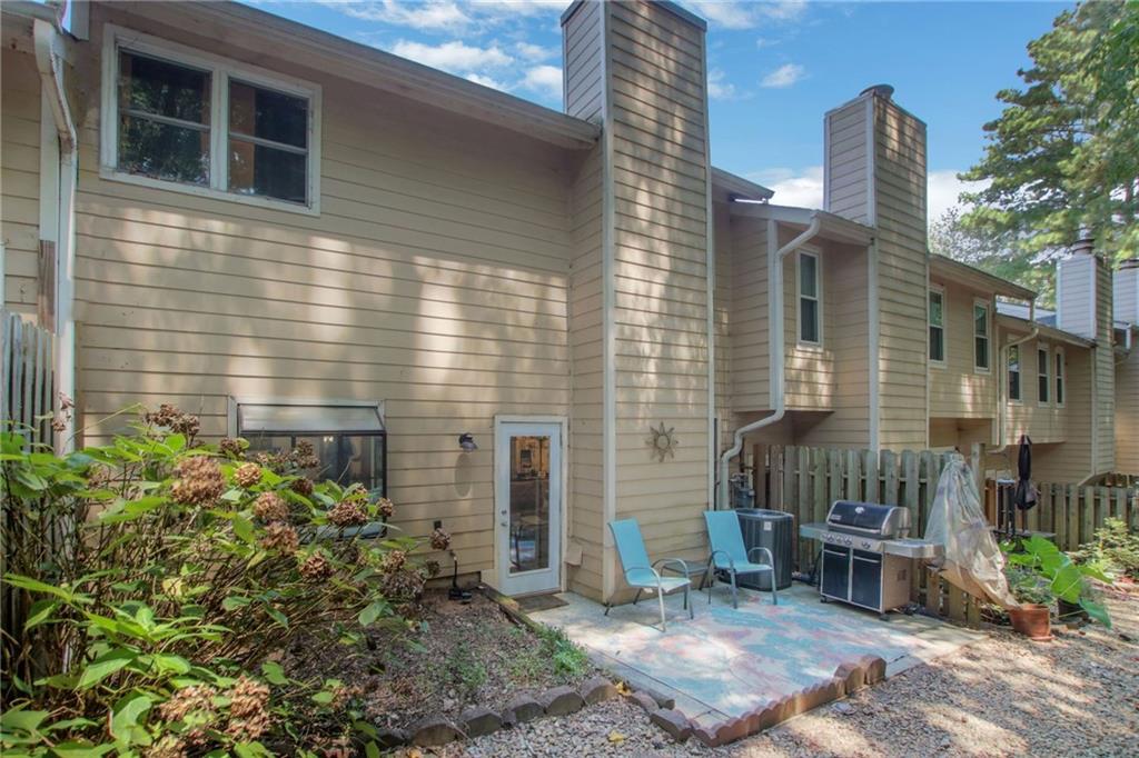 1929 Variations Drive Northeast Atlanta, GA 30329 - Photo 30 of 33 a wooden bench sitting in front of a house