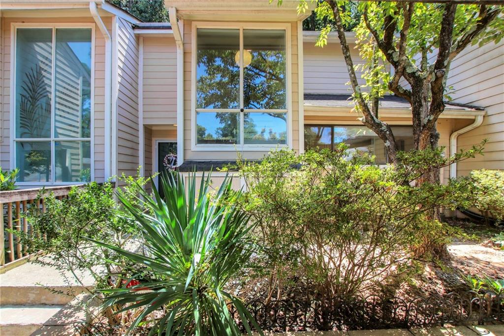 1929 Variations Drive Northeast Atlanta, GA 30329 - Photo 3 of 33 a view of a house with potted plants and a fountain