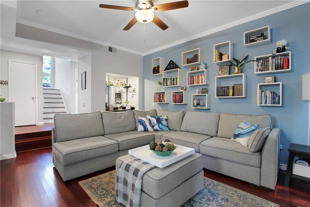 1929 Variations Drive Northeast Atlanta, GA 30329 - Photo 7 of 33 a living room with furniture and a book shelf