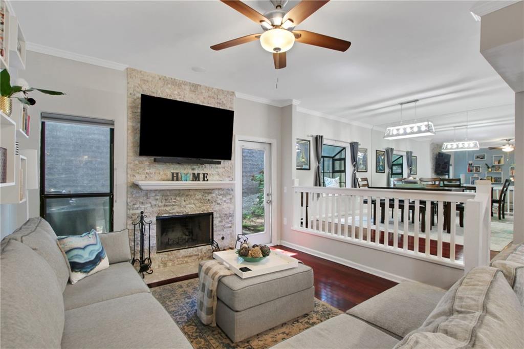 1929 Variations Drive Northeast Atlanta, GA 30329 - Photo 9 of 33 a living room with furniture a flat screen tv and a fireplace