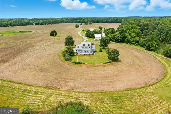 a view of a swimming pool with a yard