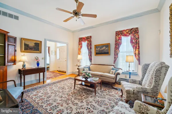 a living room with furniture and a rug