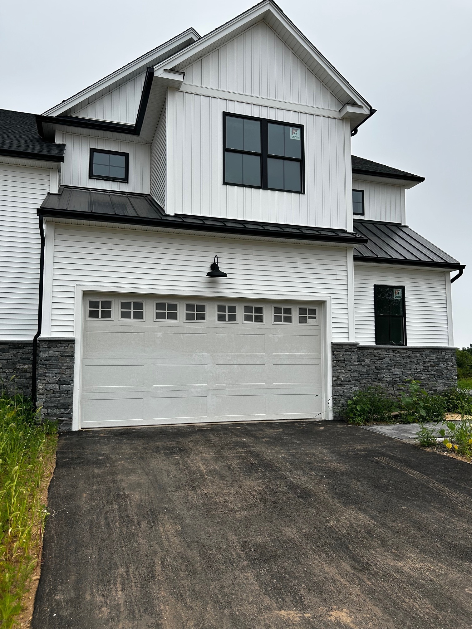 a front view of a house with garage