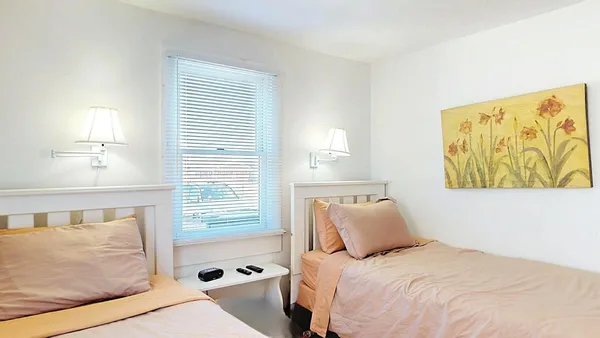 a bedroom with a bed and bathroom