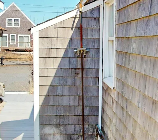 a view of a house with swimming pool and sitting area