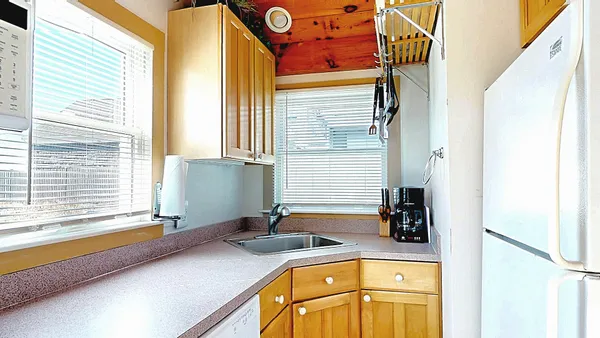 a bathroom with a sink and a window