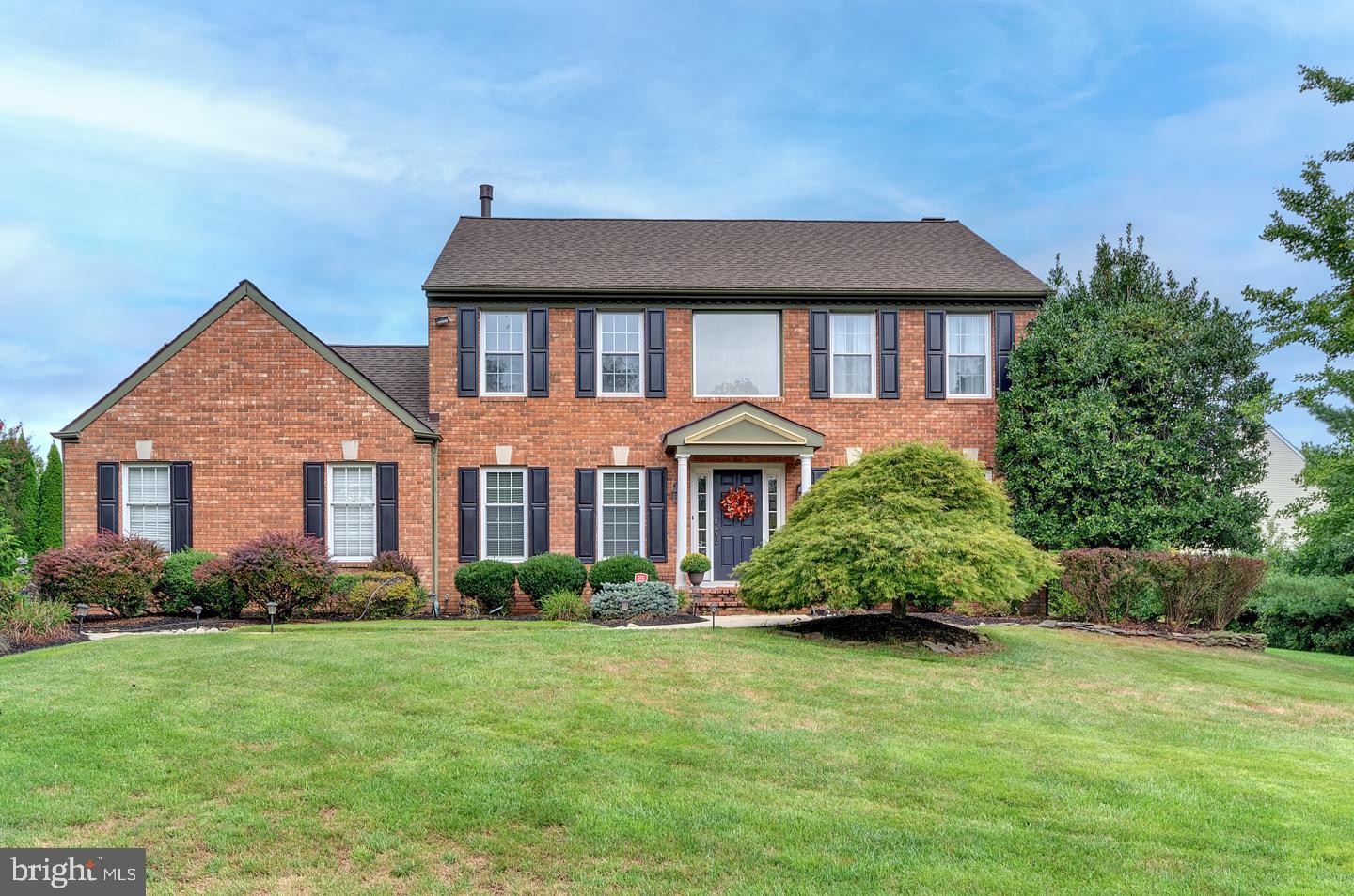 16 Garwood Court Medford, NJ 08055 - Photo 1 of 50 a front view of a house with a garden
