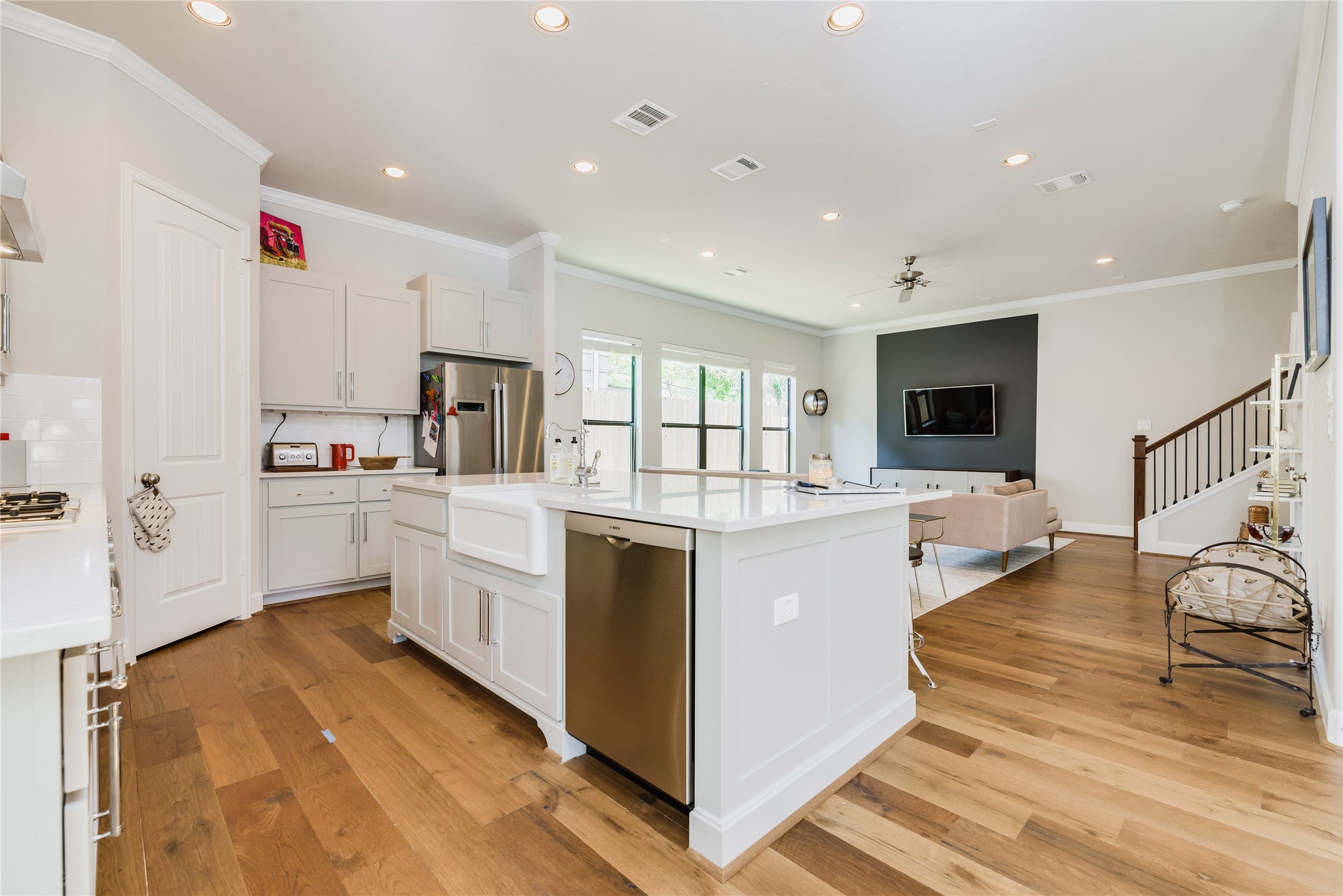 4014 Woodhead Street Houston, TX 77098 - Photo 13 of 37 a kitchen with white cabinets and white appliances