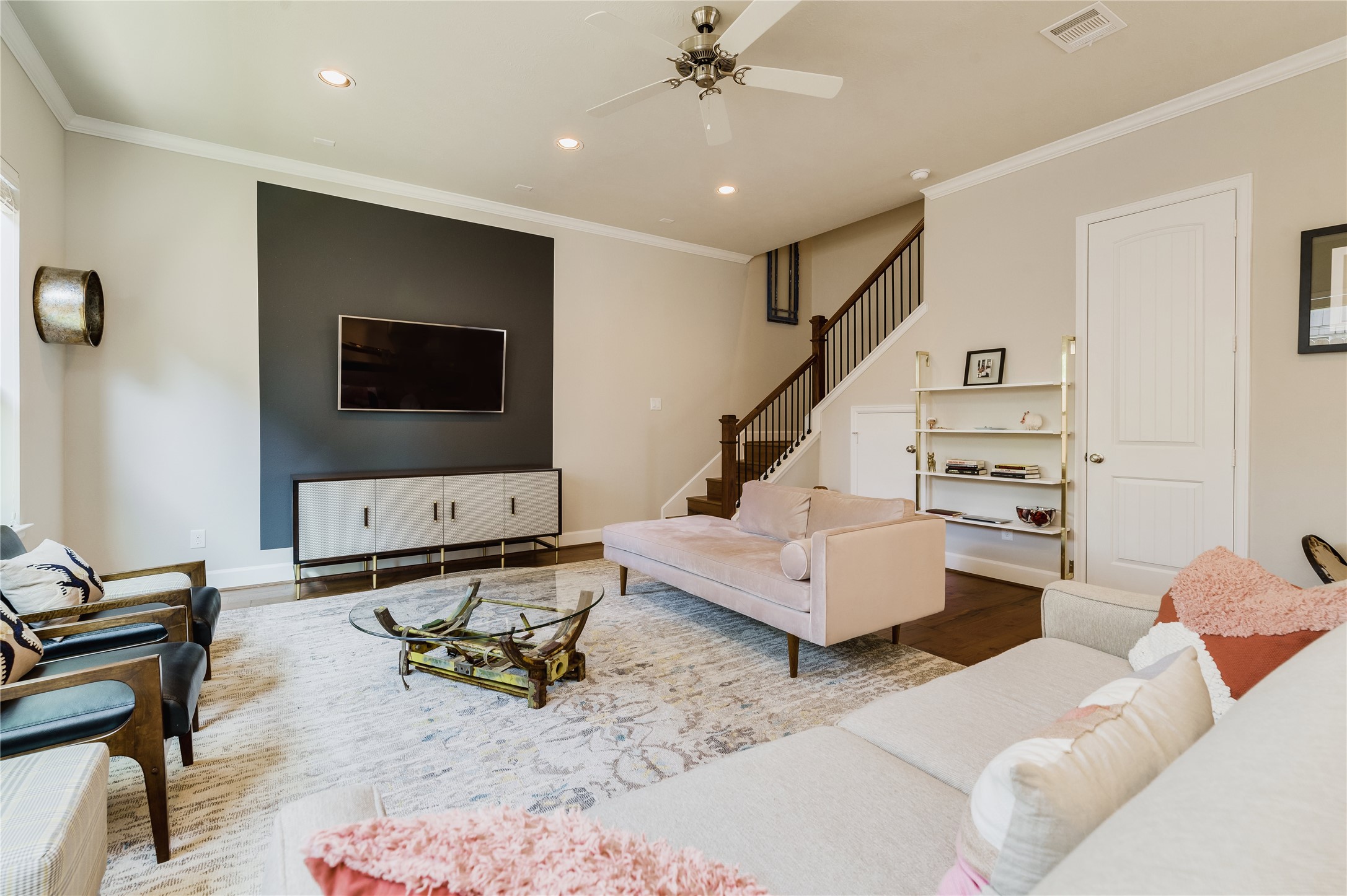 4014 Woodhead Street Houston, TX 77098 - Photo 18 of 37 a living room with furniture and a flat screen tv