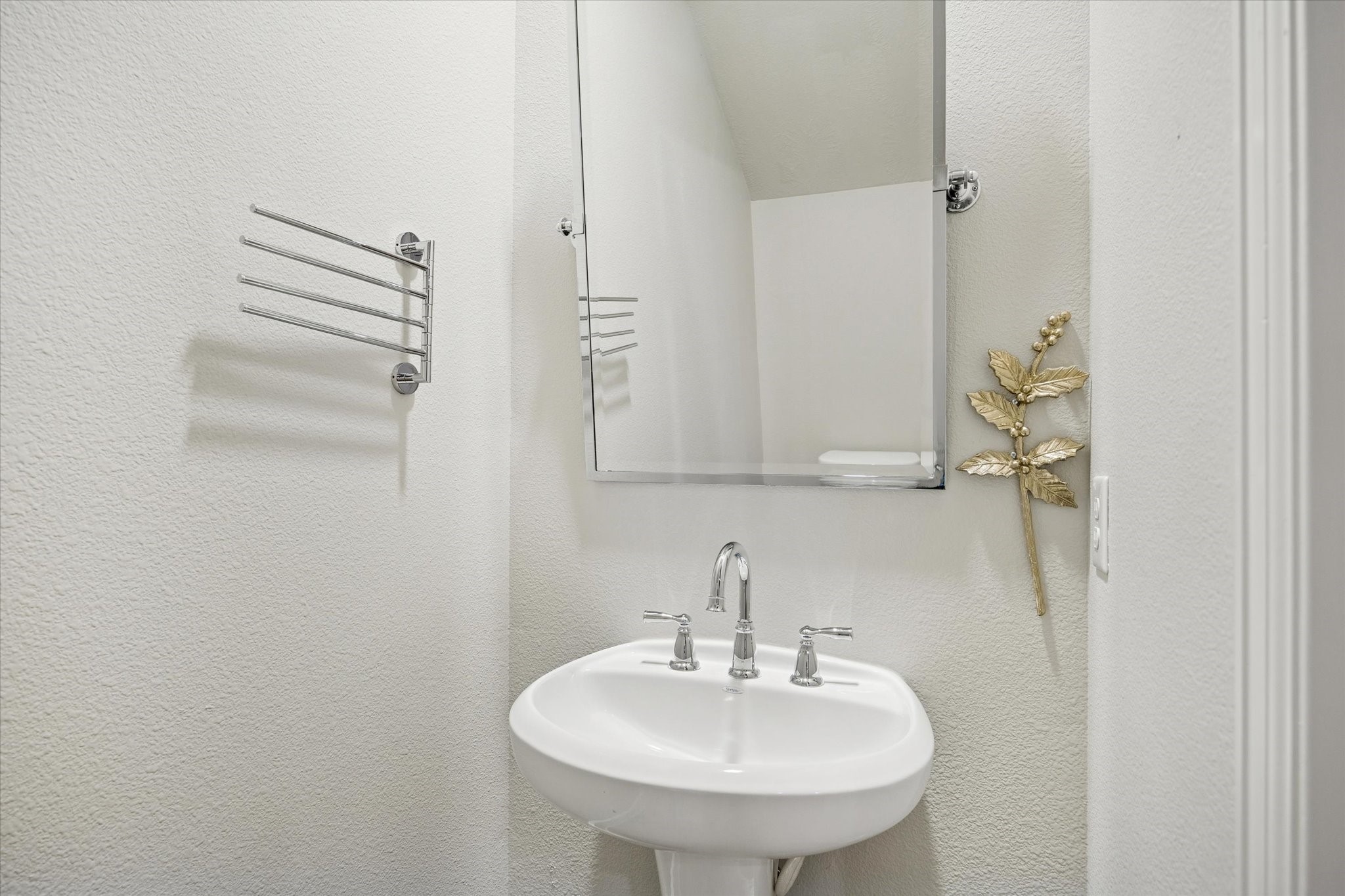 4014 Woodhead Street Houston, TX 77098 - Photo 22 of 37 a bathroom with a sink and a mirror