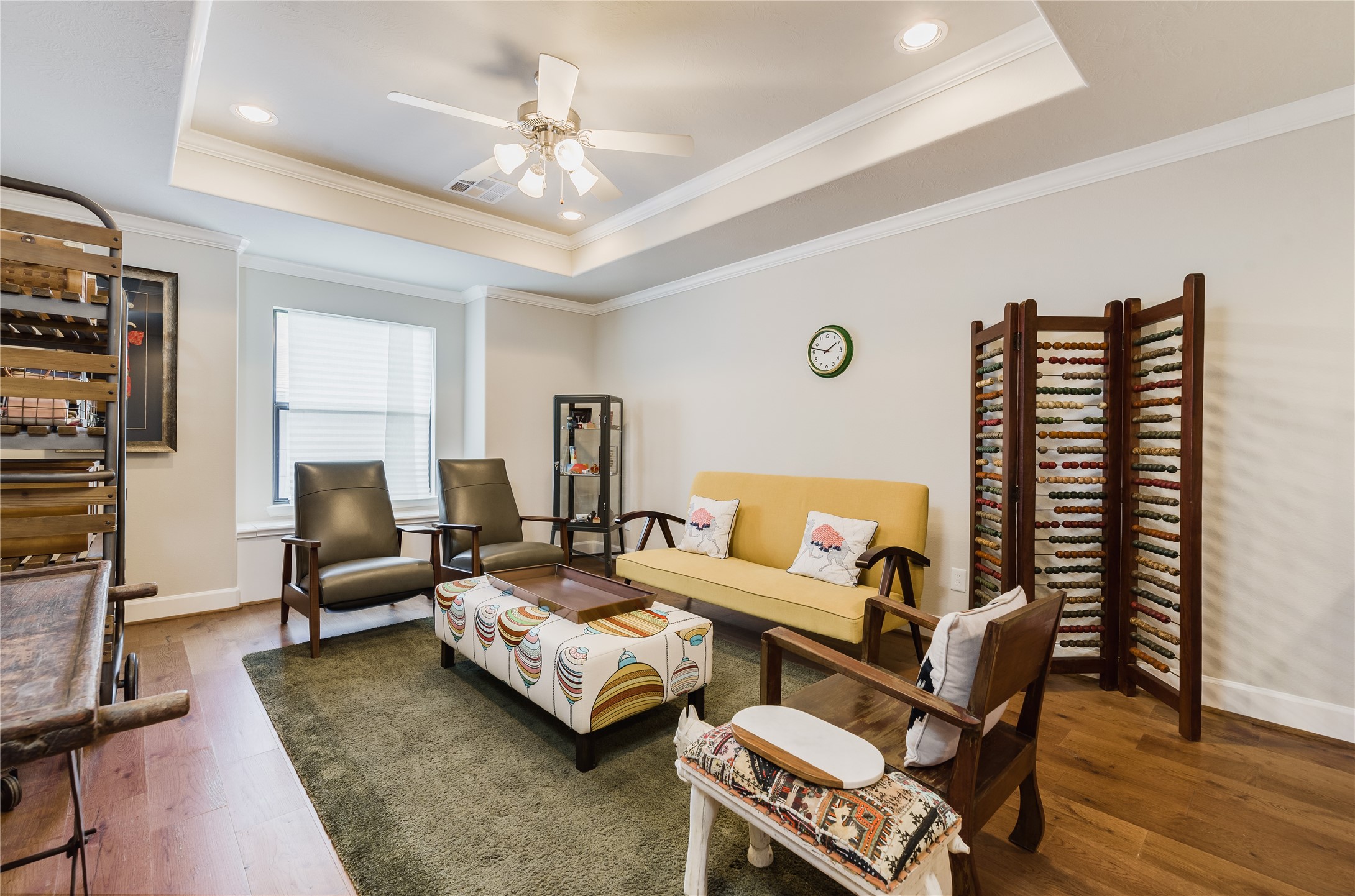 4014 Woodhead Street Houston, TX 77098 - Photo 23 of 37 a living room with furniture a fireplace and a flat screen tv