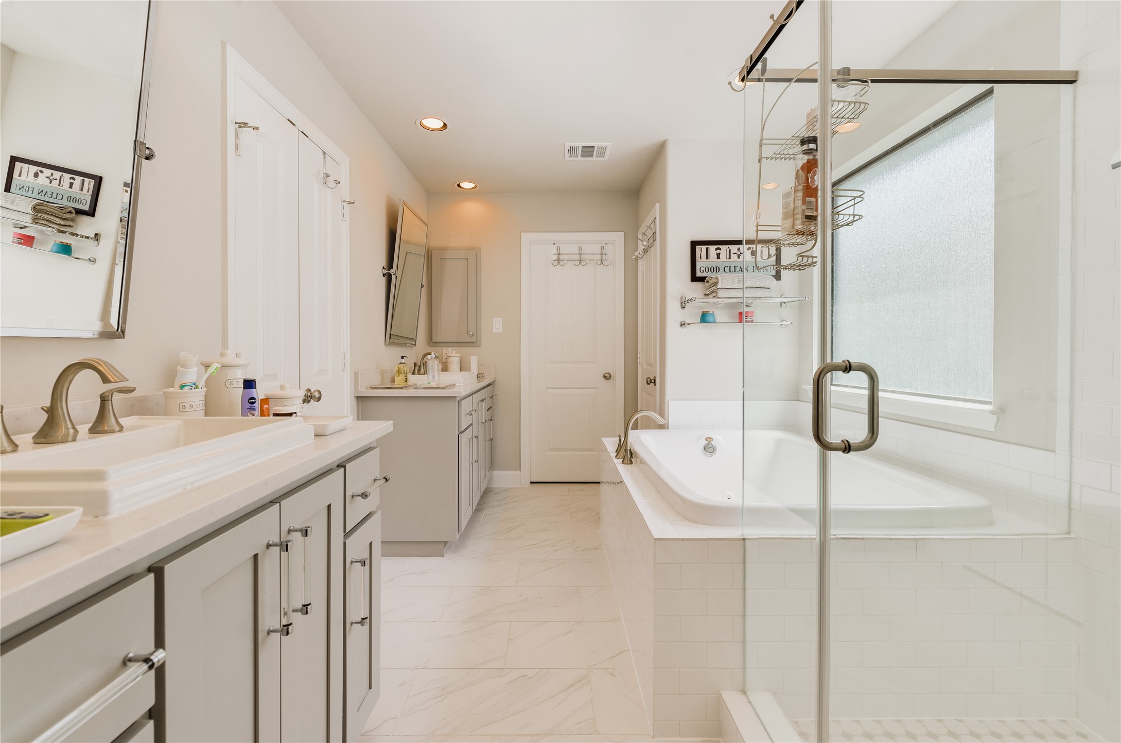 4014 Woodhead Street Houston, TX 77098 - Photo 28 of 37 a bathroom with a granite countertop sink a shower and a mirror