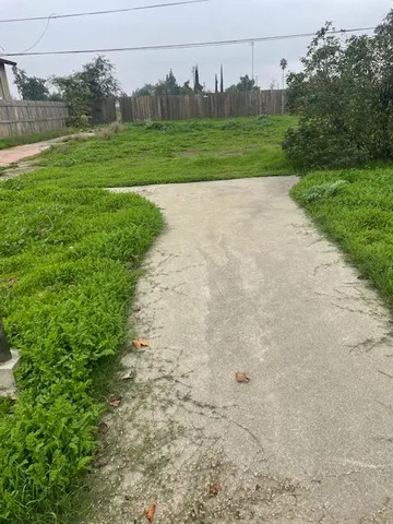 a view of a field with an trees