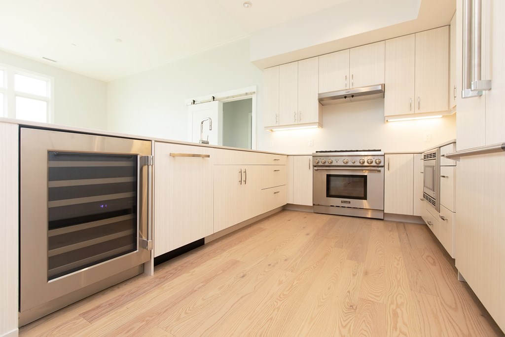 10 Shipyard Drive, Unit 517 Hingham, MA 02043 - Photo 5 of 14 a view of kitchen with microwave and stove top oven