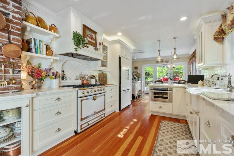 643 Manor Drive Reno, NV 89509 - Photo 12 of 37 a kitchen with stainless steel appliances a stove a sink and a refrigerator