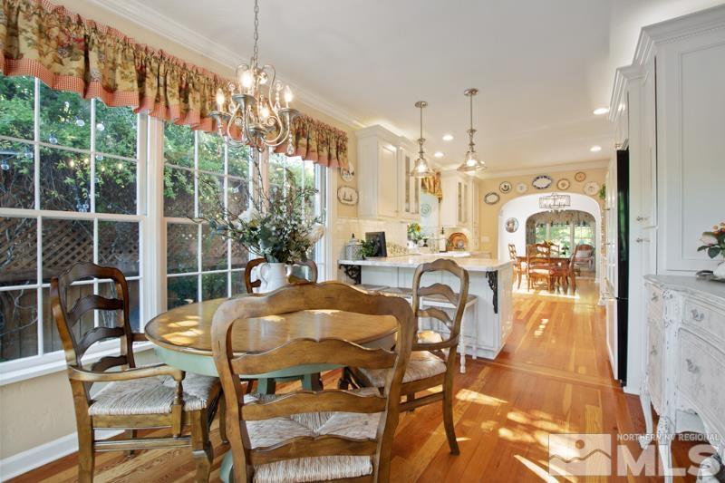 643 Manor Drive Reno, NV 89509 - Photo 15 of 37 a dining room filled with lots of furniture and a chandelier