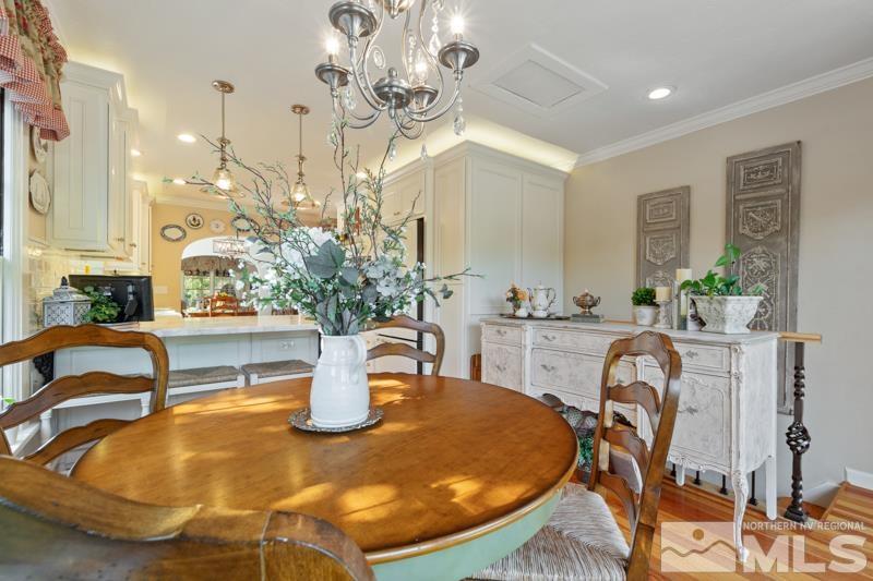 643 Manor Drive Reno, NV 89509 - Photo 16 of 37 a dining room with furniture and a chandelier
