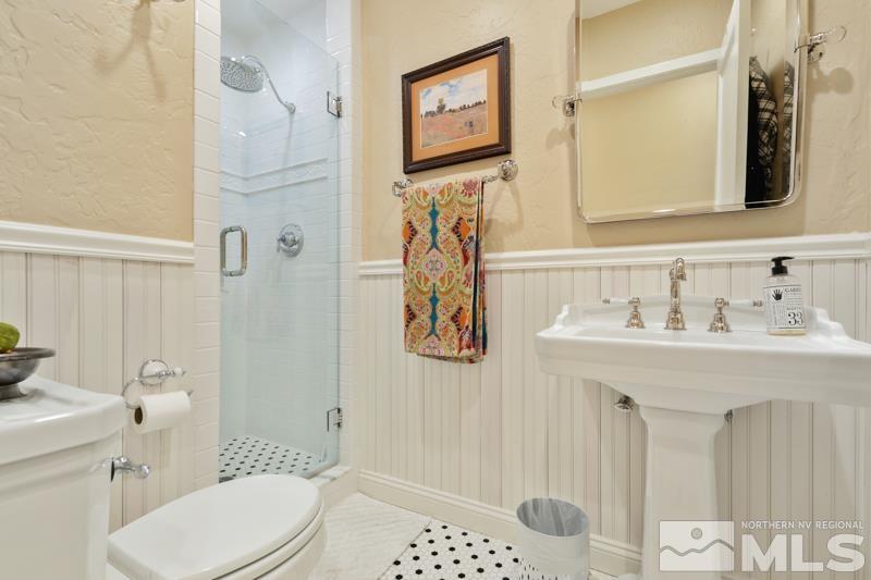 643 Manor Drive Reno, NV 89509 - Photo 21 of 37 a bathroom with a sink toilet and shower